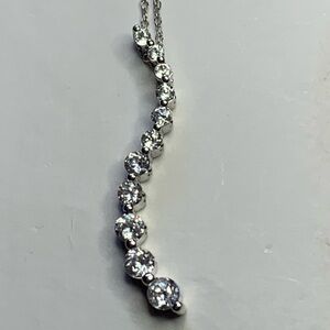 10k white gold Necklace with Sparkling Sapphire Accents. 11 total sapphire stone